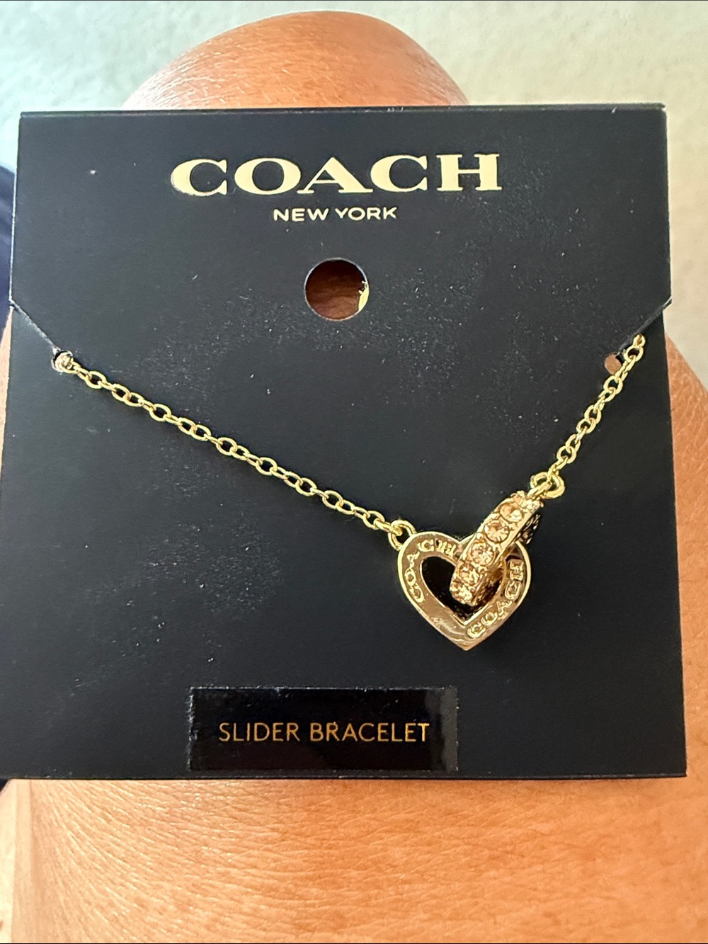 NWT.  Coach slider bracelet.  Has the coach emblem on the heart